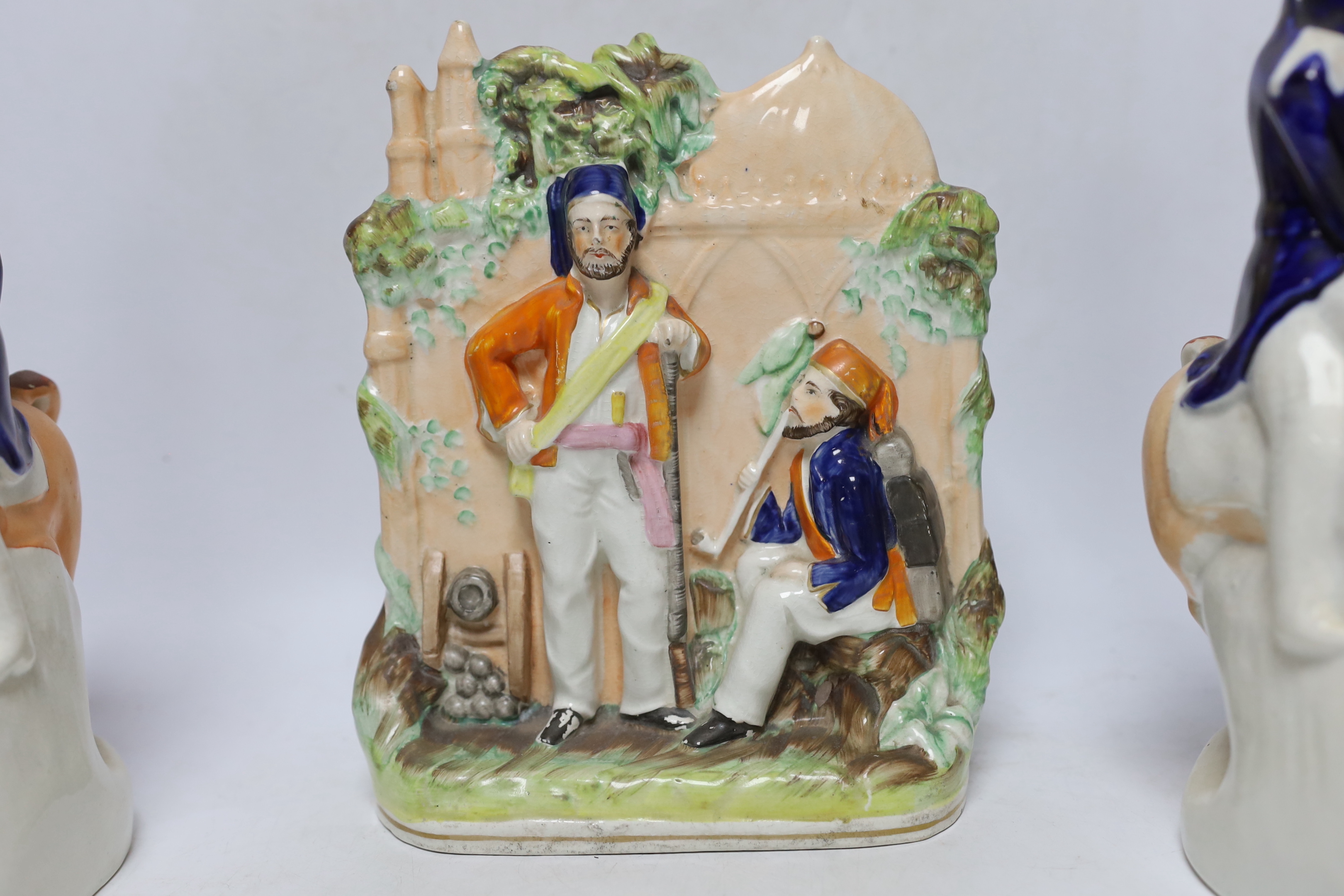 Three mid 19th century Staffordshire figure groups including Lord Raglan and Marshal Arnaud and Turkish soldiers, tallest 26.5cm